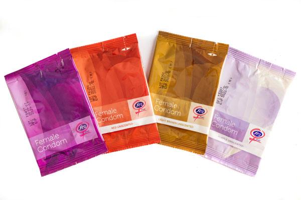 FC2 Female Condom, group product shot, purple, red, light brown, clear, in individual packages