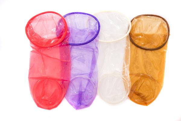 FC2 Female Condom, group product shot, purple, red, clear, light brown